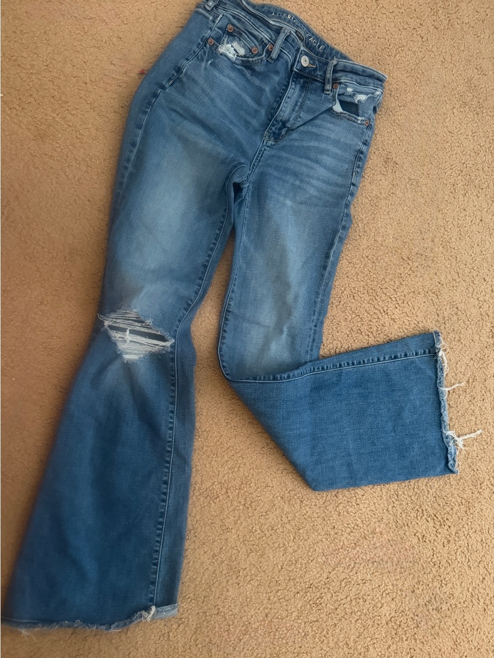 American Eagle Next Level super high-waisted ripped flare jeans